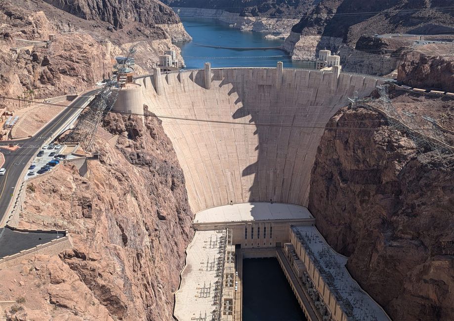Hoover Dam structure with road and lake in background