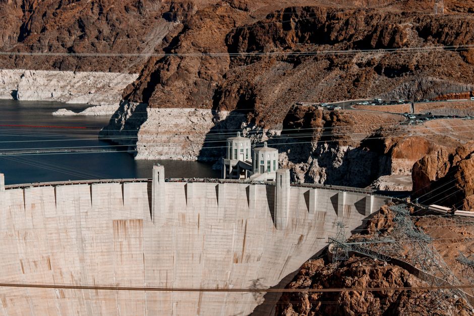 Hoover Dam with its concrete structure and power lines
