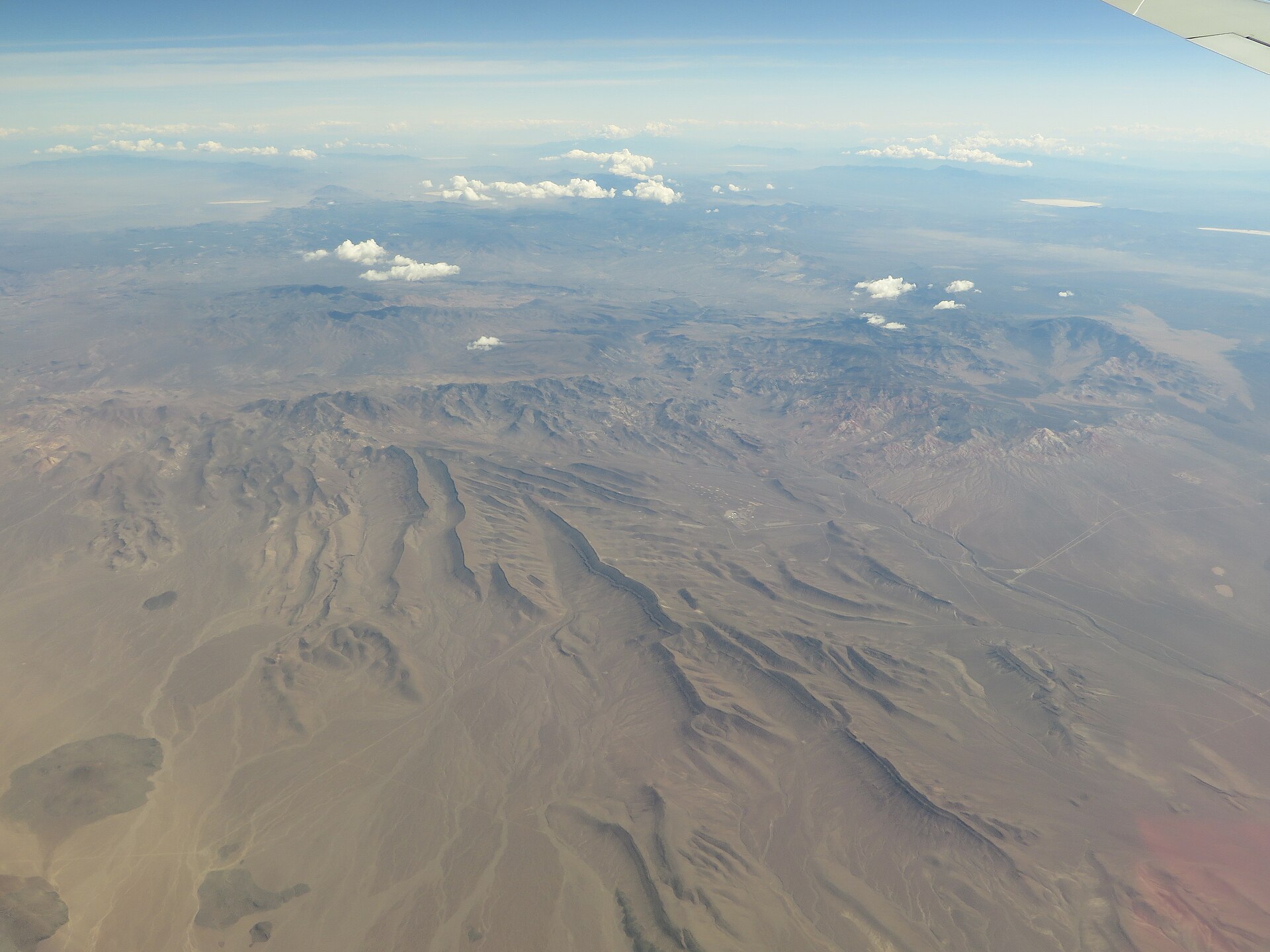 aerial view of desert landscape with mountains