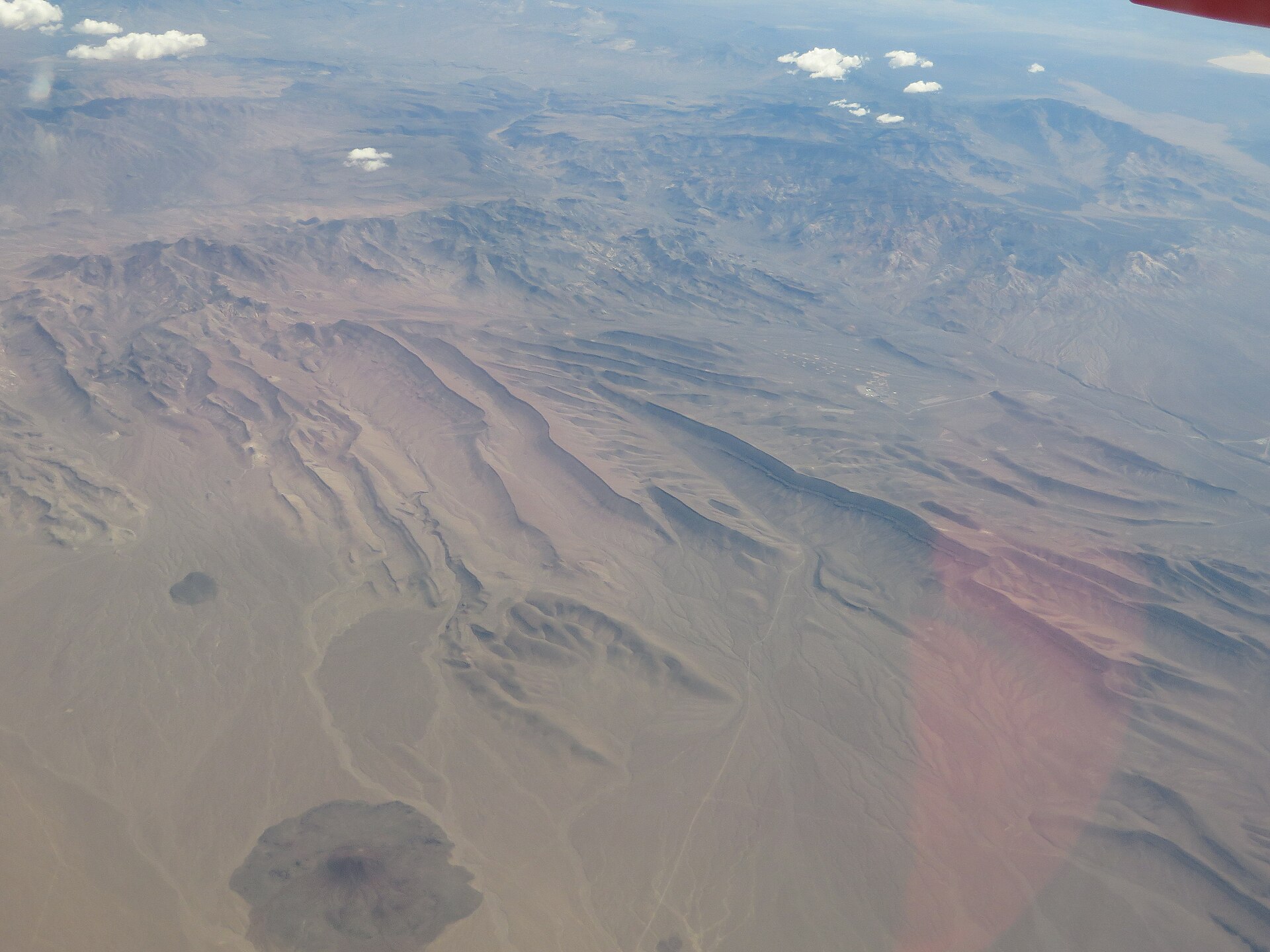 Aerial view of desert landscape with mountains